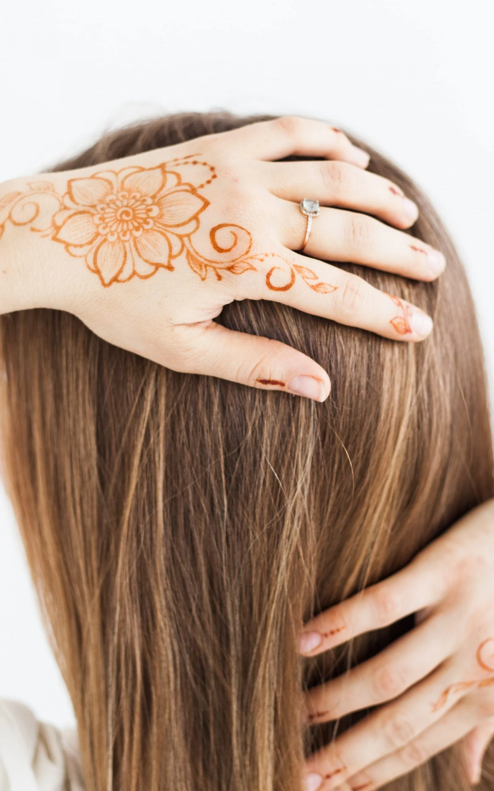 Premium Photo | Artist applying henna mehndi tattoo on female hand